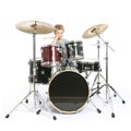 young caucasian boy plays drums in studio against white background Royalty Free Stock Photo