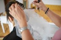 Young Caucasian bride getting her hair done for her wedding day Royalty Free Stock Photo