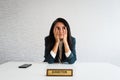 Young caucasian brunette business woman director in office in office bored thoughtful dreamy daydreaming with no work. Director Royalty Free Stock Photo