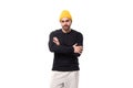 young caucasian brunette man with a beard in a casual sweatshirt stands confidently on a white background with copy Royalty Free Stock Photo