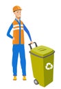 Young caucasian builder pushing recycle bin.