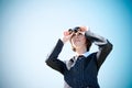 Young caucasian business lady with binoculars