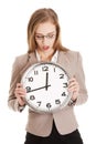 Young caucasian business woman holding clock. Royalty Free Stock Photo