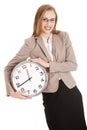 Young caucasian business woman holding clock. Royalty Free Stock Photo