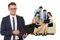 Young caucasian businessman, with his team behind holding laptop Royalty Free Stock Photo