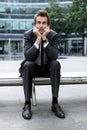 young caucasian businessman sitting on bench Royalty Free Stock Photo