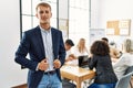 Young caucasian businessman smiling happy standing at the office during business meeting Royalty Free Stock Photo