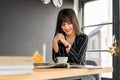 Young Caucasian businesswoman is having breakfast Royalty Free Stock Photo