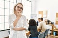 Young caucasian businesswoman smiling happy standing with arms crossed gesture at the office during business meeting Royalty Free Stock Photo