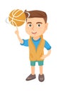 Caucasian boy spinning basketball ball on finger.