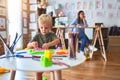 Young caucasian child playing at playschool with teacher