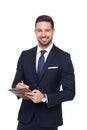 Young caucasian confident businessman writing on clipboard tooth Royalty Free Stock Photo