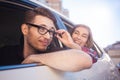 Young caucasian couple in car having fun on road trip Royalty Free Stock Photo