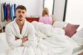 Young caucasian couple in conflict sitting on the bed at home Royalty Free Stock Photo