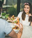 Young caucasian couple eating pizza and drinking wine in cafe Royalty Free Stock Photo