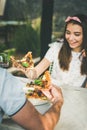 Young caucasian couple eating pizza and drinking wine in restaurant Royalty Free Stock Photo