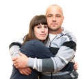 Young Caucasian couple embracing on white isolated background, looking at camera Royalty Free Stock Photo