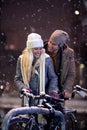 Young couple enjoying the first snow. winter, snowing, christmas, new year concept