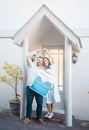 Young caucasian couple holding house keys while moving into new apartment. Happy man and woman holding for sale and sold Royalty Free Stock Photo