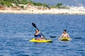 Young caucasian couple kayaking in sea Royalty Free Stock Photo