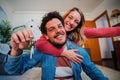 Young caucasian couple showing keys of their first house after purchase and moving to new home together. happy husband Royalty Free Stock Photo