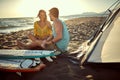 Young caucasian couple sitting together with legs intertwined, cuddling