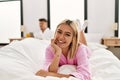 Young caucasian couple smiling happy lying on the bed at home Royalty Free Stock Photo