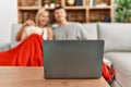 Young caucasian couple smiling happy watching movie eating popcorn at home Royalty Free Stock Photo