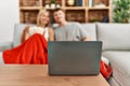 Young caucasian couple smiling happy watching movie eating popcorn at home Royalty Free Stock Photo