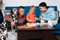 Young Caucasian family with a dog do creative work at home Royalty Free Stock Photo