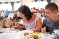 Young caucasian family having dinner together Royalty Free Stock Photo