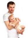 Young Caucasian father with baby son against white