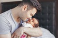 Young Caucasian father dad with his newborn mixed race Asian Chinese baby Royalty Free Stock Photo