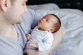 Young Caucasian father dad with his newborn mixed race Asian Chinese baby Royalty Free Stock Photo
