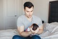 Young Caucasian father dad with his newborn mixed race Asian Chinese baby Royalty Free Stock Photo