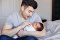 Young Caucasian father dad with his newborn mixed race Asian Chinese baby Royalty Free Stock Photo