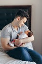 Young Caucasian father dad with his newborn mixed race Asian Chinese baby Royalty Free Stock Photo