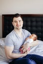 Young Caucasian father dad with his newborn mixed race Asian Chinese baby Royalty Free Stock Photo