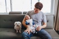 Young Caucasian father playing with newborn baby.