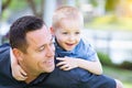 Playful Caucasian Father and Son Having Fun At The Park Royalty Free Stock Photo