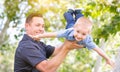 Young Caucasian Father and Son Having Fun At The Park Royalty Free Stock Photo