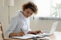 Female doctor work on laptop write in medical journal Royalty Free Stock Photo