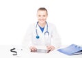Young Caucasian female doctor working in an office Royalty Free Stock Photo