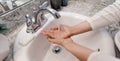 Young Caucasian Female Hands Lathering White Bar Hand Soap for Washing and Personal Hygiene, and Then Rinsing Hand Under Sink Wate Royalty Free Stock Photo