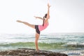 Young caucasian female practicing yoga on the seaside Royalty Free Stock Photo