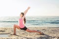 Young caucasian female practicing yoga on the seaside Royalty Free Stock Photo