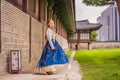Young caucasian female tourist in hanbok national korean dress at Gyeongbokgung Palace. Travel to Korea concept Royalty Free Stock Photo
