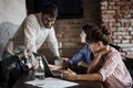 Young caucasian freelancers having casual business meeting in cafe Royalty Free Stock Photo