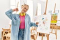 Young caucasian girl at art studio stretching back, tired and relaxed, sleepy and yawning for early morning Royalty Free Stock Photo