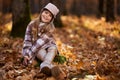 Young caucasian girl, candid autumnal portrait in the forest Royalty Free Stock Photo